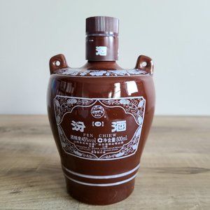 Ceramic empty liqueur bottle with handles. Fen Chiew.